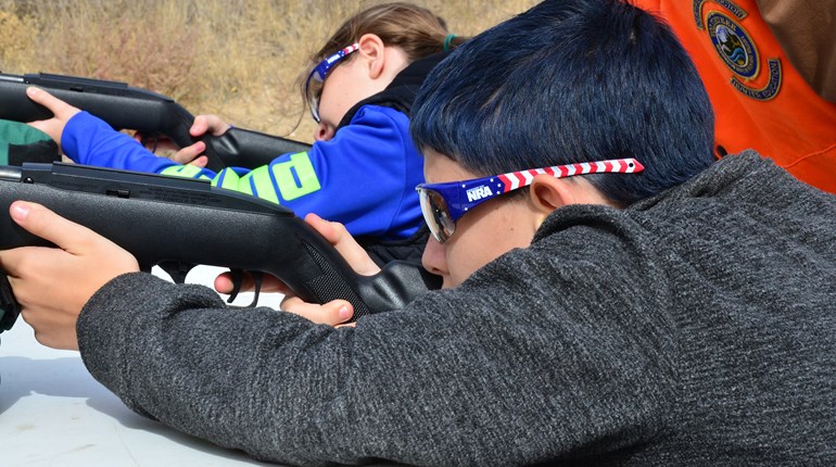 Young shooters take aim at an outdoor range