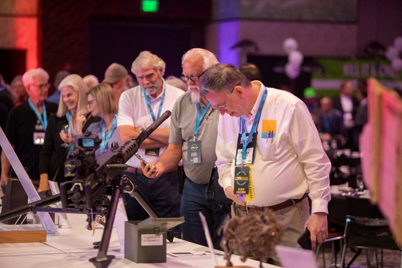 people viewing auction items at the 2024 NRA Foundation Banquet & Auction