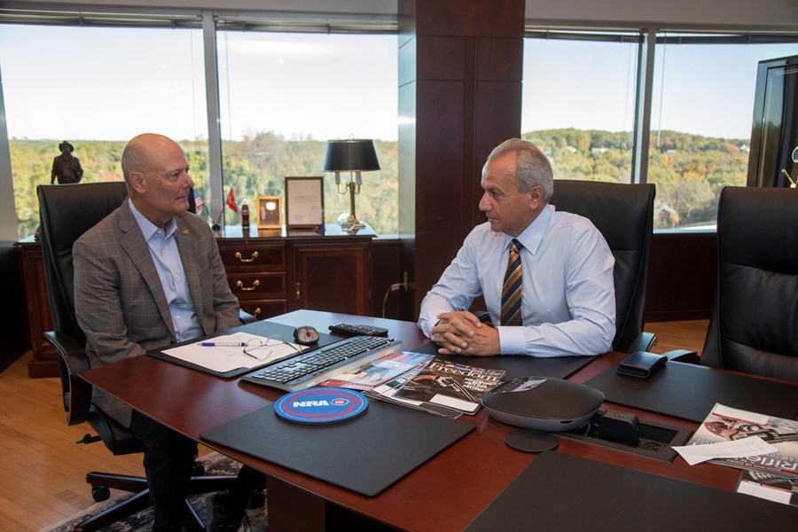 NRA Executive Vice President and CEO Doug Hamlin speaks with Henry Repeating Arms Founder and CEO Anthony Imperato during his visit to NRA headquarters in Fairfax, Va., on Oct. 17. 2025. (Photo by Peter Fountain)